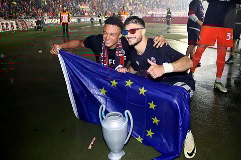 Bologna players celebrate Champions League qualification